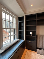 Bedroom built in with dark stain and open shelves