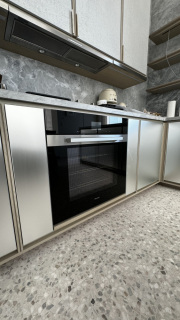 GRAY OAK AND SATIN GLASS FRONT KITCHEN